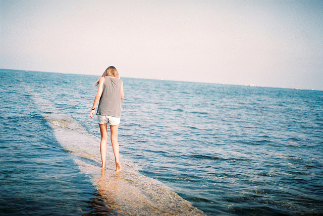 Girl walking on path in water